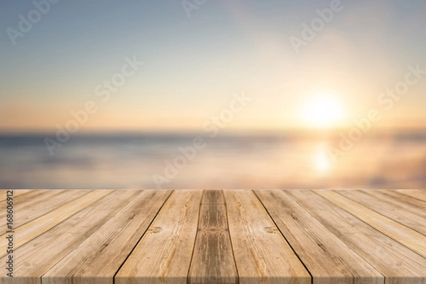 Obraz Wooden table with beach background 