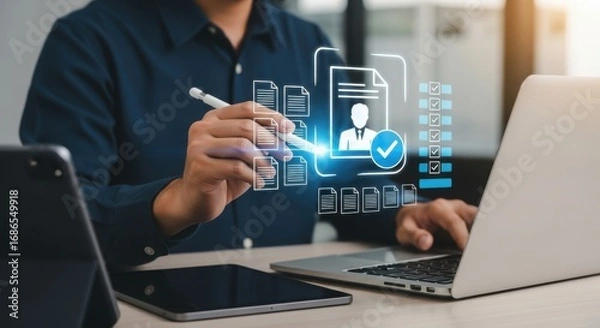 Fototapeta A person uses a stylus to interact with a digital interface showing document icons and a checklist on a laptop