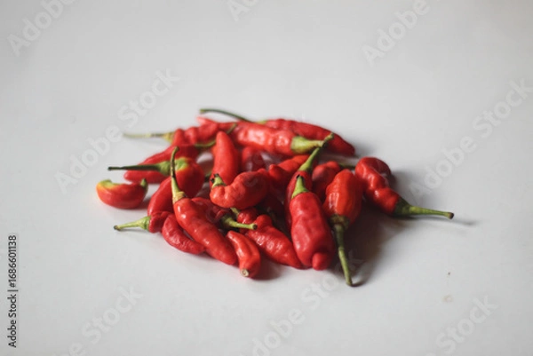 Obraz red chilies on a plain white background