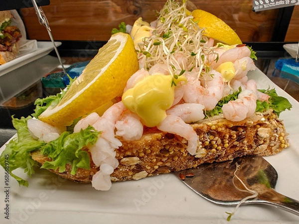 Obraz Typical Norwegian sandwich with baby shrimp, lemon, mayonnaise, lettuce and sprouted wheat