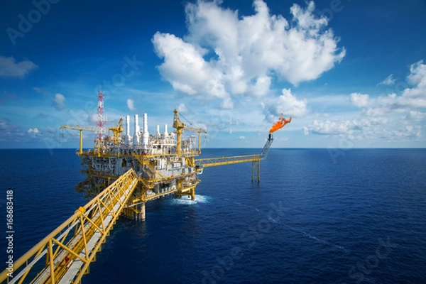 Fototapeta Offshore construction platform for production oil and gas. Oil and gas industry and hard work. Production platform and operation process by manual and auto function from control room.