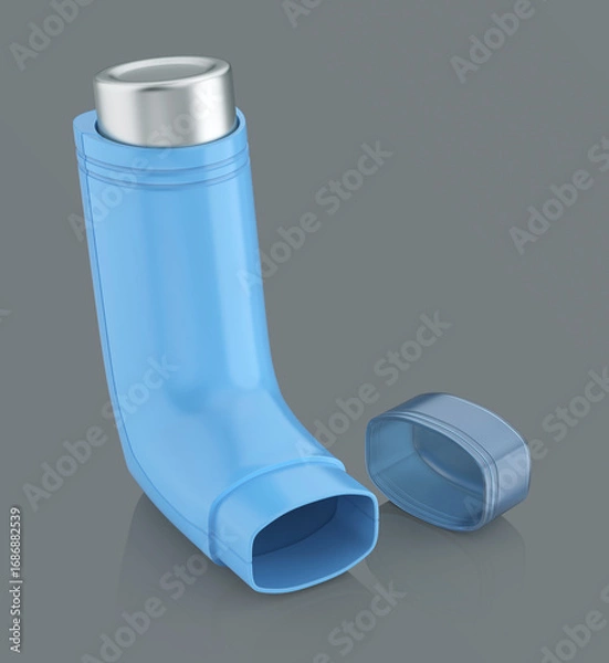 Fototapeta Blue portable asthma inhaler on shiny grey background
