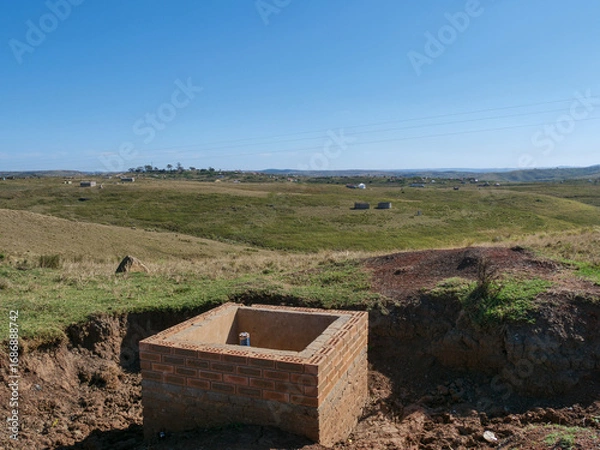 Fototapeta Square brick foundation build for future clean and sustainable water use in rural Transkei, South Africa