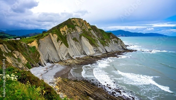 Obraz Coastal cliffs meet a sandy beach
