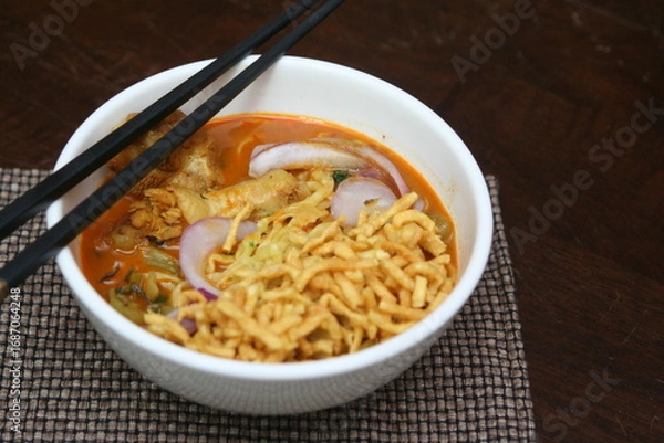 Obraz Northern Thai food Khao Soi, a spicy Thai dish consisting of noodles and a delicious curry and coconut milk, is spicy.