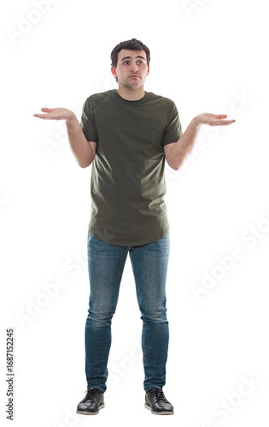 Fototapeta Young man spreads arms confused what to choose. Male shrugs shoulders puzzled and undecided. Difficult choice concept with full length model isolated on transparent background