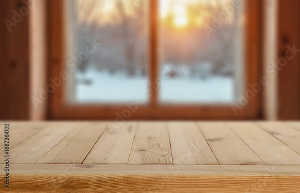 Fototapeta Empty wooden table with copy space for product placement and wooden window with winter background outside.