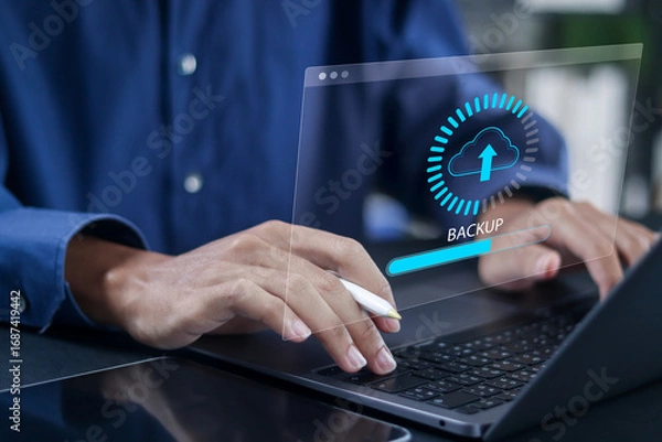 Fototapeta Backup storage data, business data cloud backup, digital data storage and connection service. Person using laptop with online cloud backup.