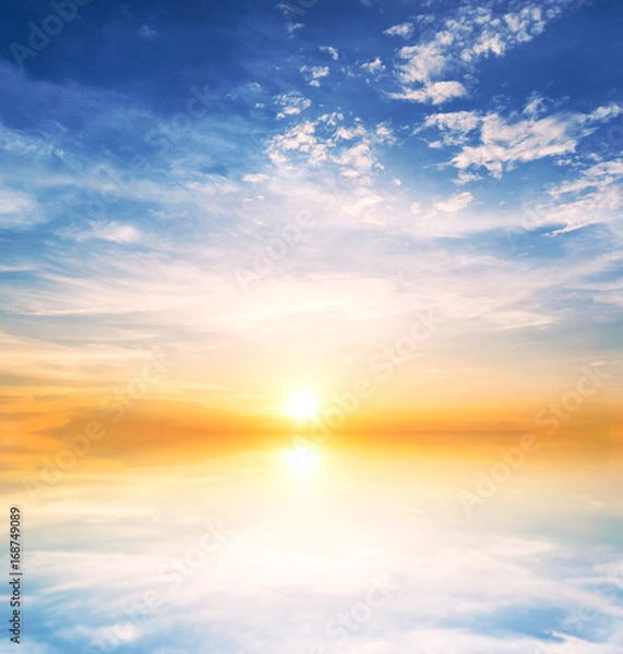 Fototapeta Background sky during sunset and water reflections.