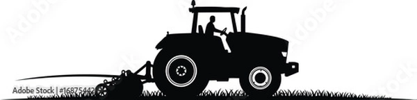 Fototapeta a farmer operating tractor in field silhouette