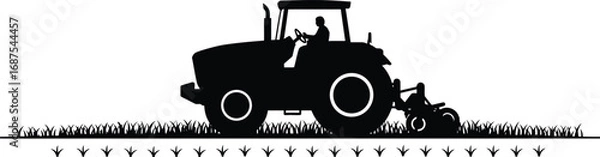 Fototapeta a farmer operating tractor in field silhouette