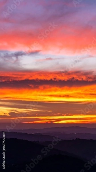 Obraz Vibrant sunset over mountain ranges