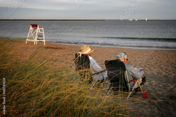 Fototapeta Enjoying a peaceful sunset at the beach