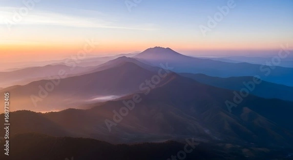 Obraz Majestic Sunrise Over Rolling Mountain Ranges: Breathtaking Aerial View of Serene Landscape
