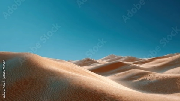 Fototapeta An expansive desert landscape with towering sand dunes under a clear blue sky