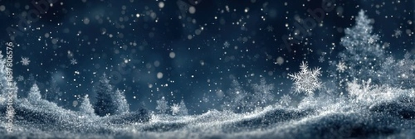 Fototapeta Winter wonderland landscape with falling snowflakes and frosted trees at night