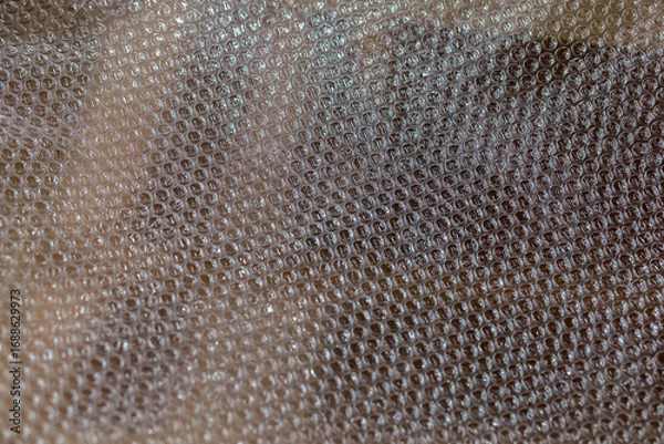 Fototapeta Texture of bubble wrap. Lumpy background. Close-up of packaging material. Protective Packaging Film