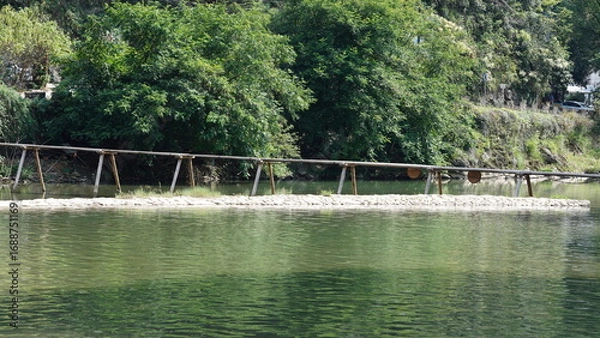 Fototapeta The classical wooden bridge view located in the countryside of the China
