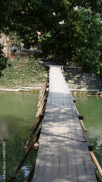 Fototapeta The classical wooden bridge view located in the countryside of the China
