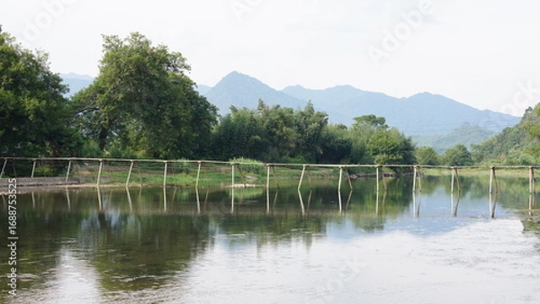 Fototapeta The classical wooden bridge view located in the countryside of the China
