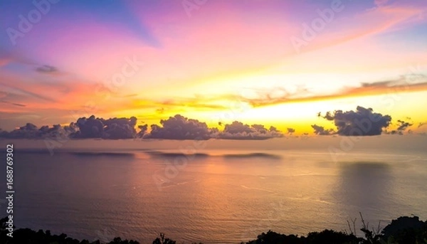 Fototapeta Vibrant Sunset Over Ocean with Colorful Clouds