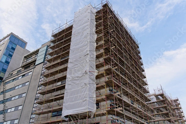 Fototapeta High rise residential building of flats with cladding being replaced with fire resistant materials