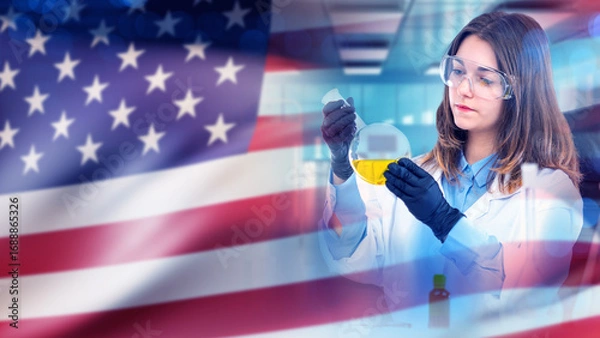 Fototapeta Woman laboratory technician near US flag. American biolab employee. Woman with test tube works as scientist. Laboratory technician conducts biological experiments. US lab technician in white coat