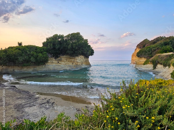 Fototapeta Beach at Canal d'Amour cove near Corfu, Greece, featuring turquoise water, rocky cliffs, and lush vegetation