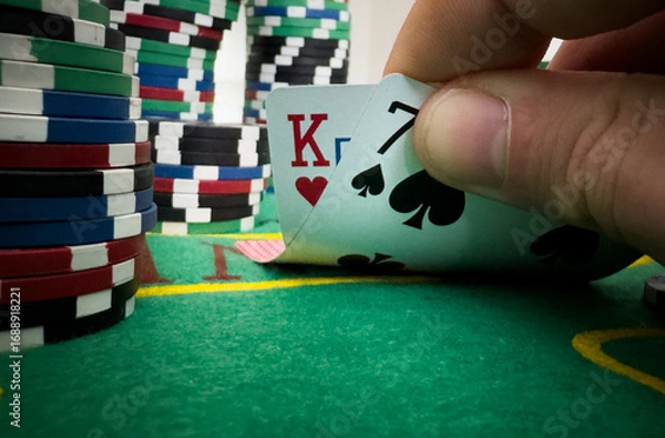 Fototapeta professional poker game. Green poker table with two games. poker player folds by throwing cards on the table