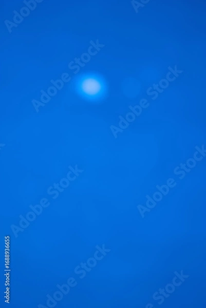 Obraz Vertical blue abstract background with soft bokeh lights. Clean and modern corporate design, perfect for mobile wallpapers, story templates, or technology presentations. Ample copy space.