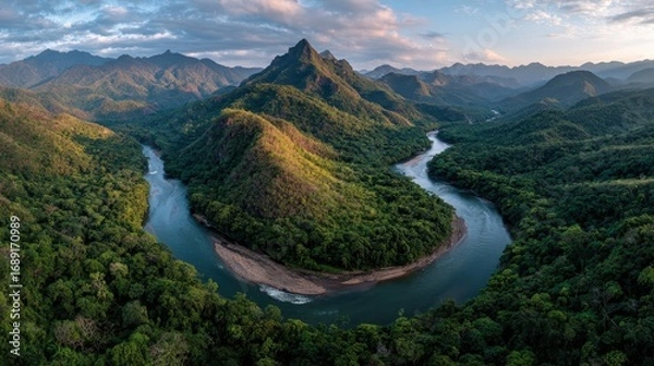 Fototapeta Panoramic shot of Peruvian Amazon selva peruana winding river surrounded by dense rainforest golden hour lighting adventure travel photography