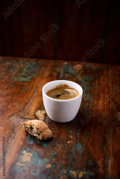 Fototapeta Cup of coffee on rustic wooden background. Soft focus. Copy space	