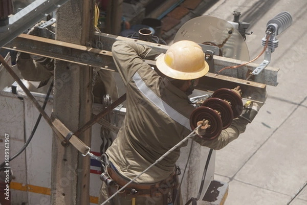 Obraz Electrical Worker on Utility Pole and Lineman Maintenance Work