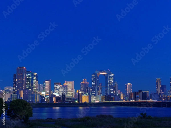 Fototapeta 梅田の高層ビル群と淀川の夜景