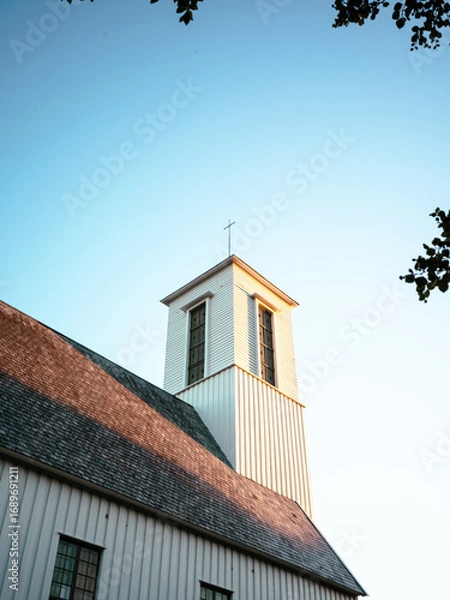 Obraz Bell tower of a church in Melbu in the sun and stone roof tiles