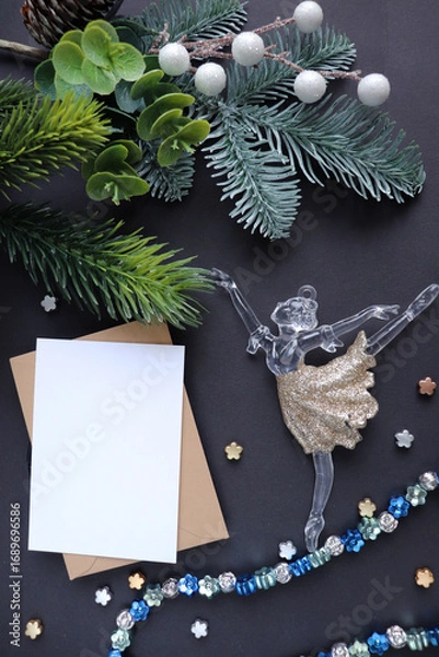 Fototapeta figurine of a ballerina girl on a Christmas tree. christmas card for ballerina greeting card design. flat lay. view from above	