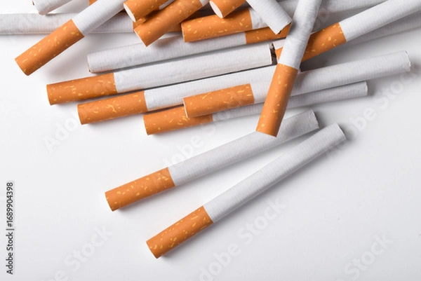 Fototapeta Cigarettes with filter isolated on white background. Bad habits. Smoking leads to lung cancer