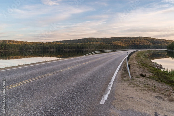 Fototapeta Empty road between lakes in Lapland.