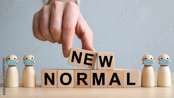 Fototapeta Embracing the new normal with masks and wooden blocks representing change