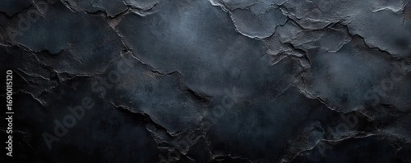 Fototapeta dark cracked textured surface with peeling layers and rough edges creating an abstract moody background