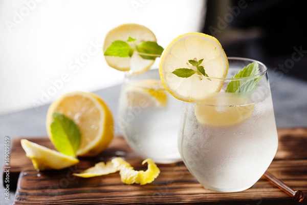Fototapeta Sparkling lemonade with lemon and mint