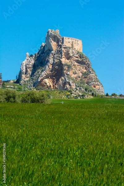 Fototapeta The castle of Mussomeli is a fortress built between the fourteenth and fifteenth centuries, in spring. Caltanissetta, Sicily, Italy.