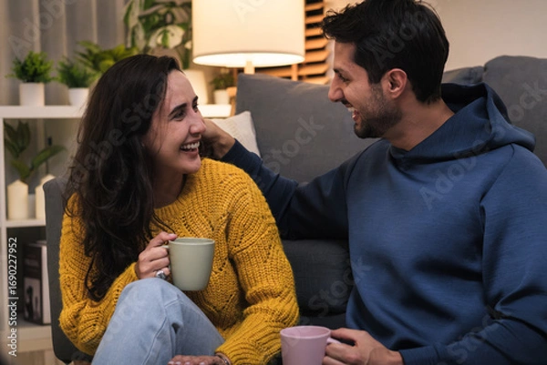 Fototapeta Couple talking and relaxing at home, enjoying lifestyle and happy relationship together with love and open communication.
