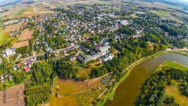 Fototapeta High altitude, wide angle, aerial view of Drohiczyn, a picturesque town in Eastern Poland at the Bug River. 