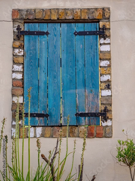 Fototapeta Old Blue shutters on square window for use as background