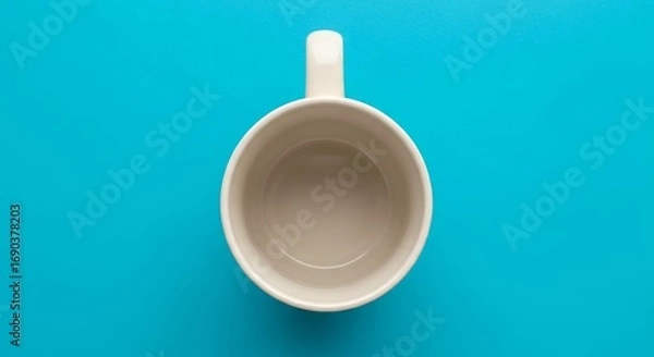 Fototapeta Empty White Ceramic Coffee Cup on Bright Blue Textured Background Top Down View