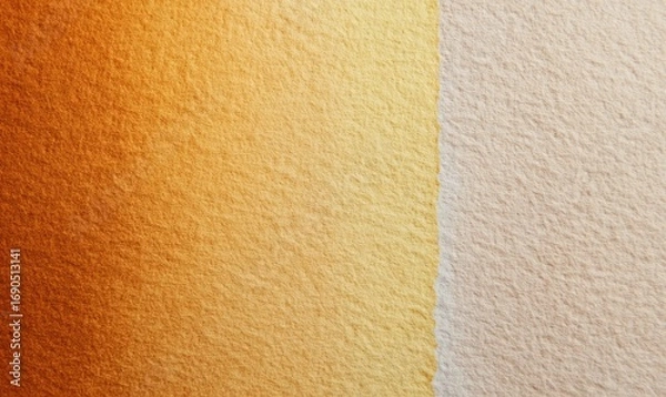 Fototapeta A tan and gold wall with a slightly darker shade of tan