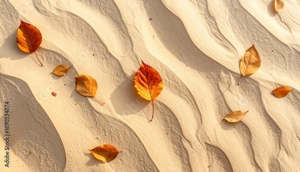 Obraz Fallen leaves scattered across smooth desert sand dunes
