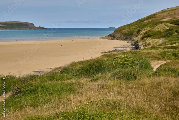 Fototapeta The beach at Rock, Cornwall on a sunny summer's day.