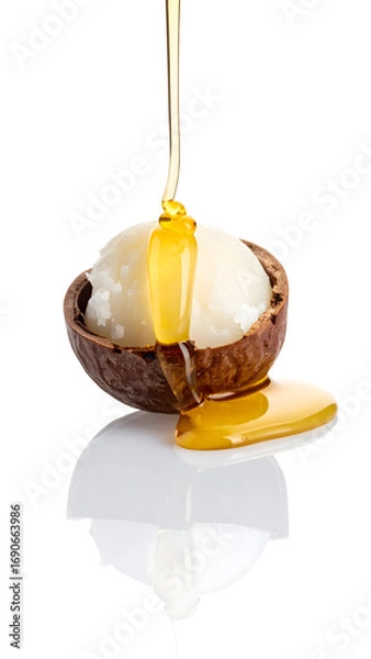 Fototapeta Pure Shea Butter with Golden Honey Dripping in Bowl
